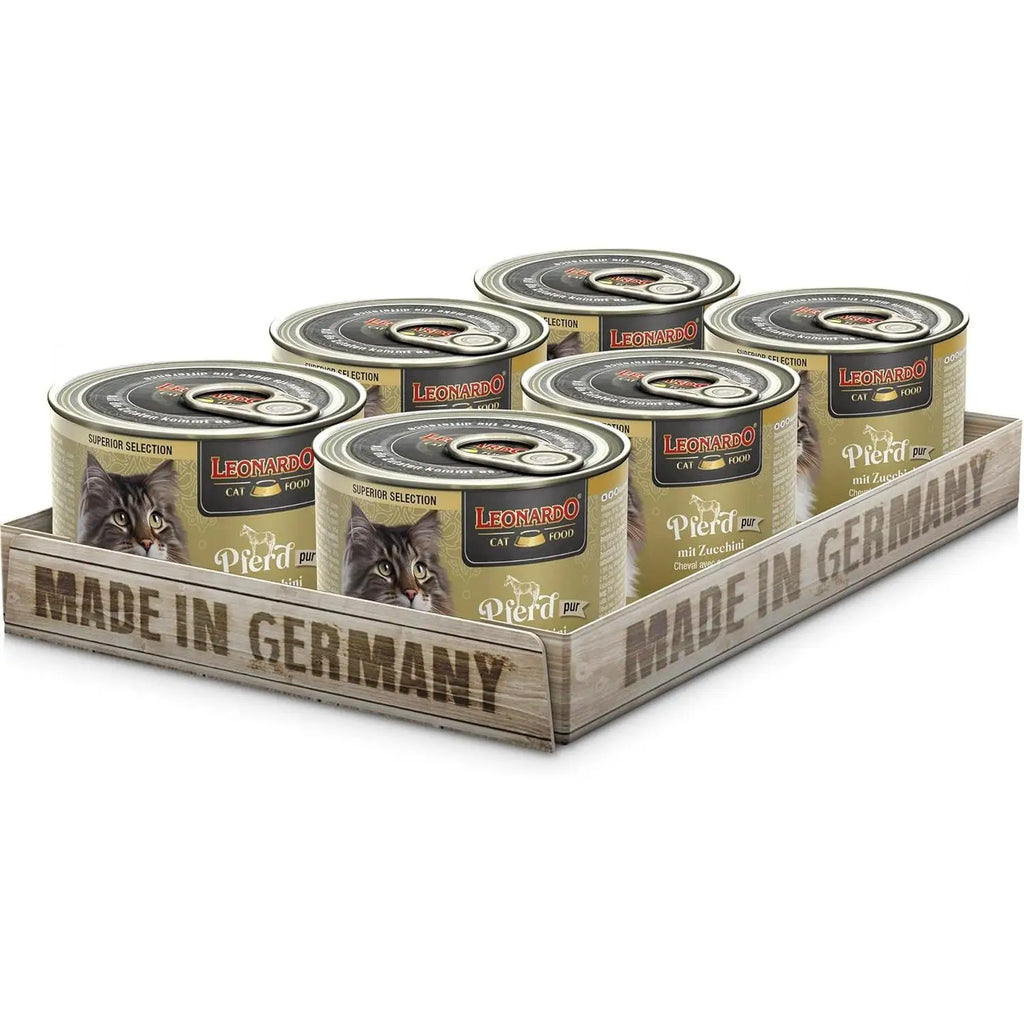 Leonardo grain-free wet food for adult cats in a wooden display, made in Germany, featuring six cans.