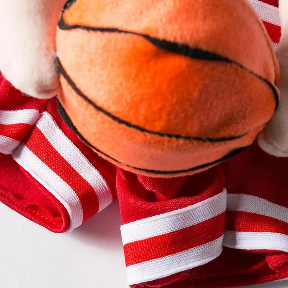 Close-up of dog baskJ basketball costume with plush basketball and red striped details, perfect for pets.