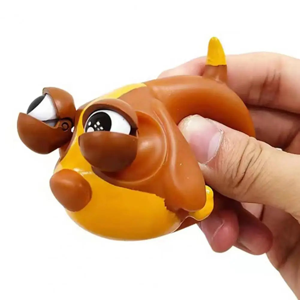 Cute Puppy Dog Doll Decompression Toy being squeezed for stress relief with cartoonish eyes.